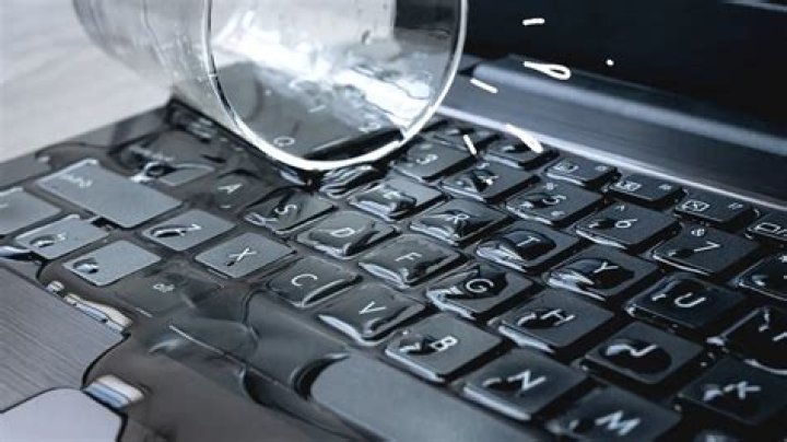 How to deal with a key being pressed all the time, and interfering with mouse functionality, after I spilled liquid on the keyboard